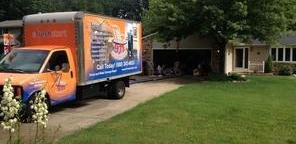 Water Damage and Mold Restoration Truck At Job Site