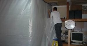 Disaster Restoration Tech Sealing Mold with Vapor Barrier